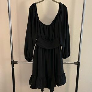 Black long sleeve dress with open dress and bow detail